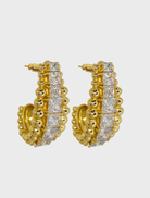 Elegant gold earrings named Marilyn, showcasing a refined and stylish design suitable for various occasions.