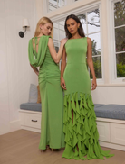 The Ferngreen Marisol Cowl Neck Gown showcases a draped neckline, ruched skirt, and a sophisticated tie closure at the back.