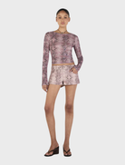 Long sleeve mauve top with a trendy snake pattern, ideal for adding flair to any outfit.