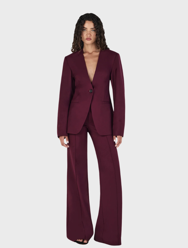 Maxine's maroon collarless blazer, showcasing a modern silhouette ideal for versatile styling and professional attire.