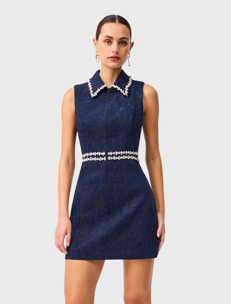 Elegant blue Melody Jacquard Mini Dress with a fitted design, showcasing intricate fabric patterns for a chic look.