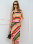 An emerald striped mesh midi skirt, offering a contemporary and sophisticated silhouette for various occasions.