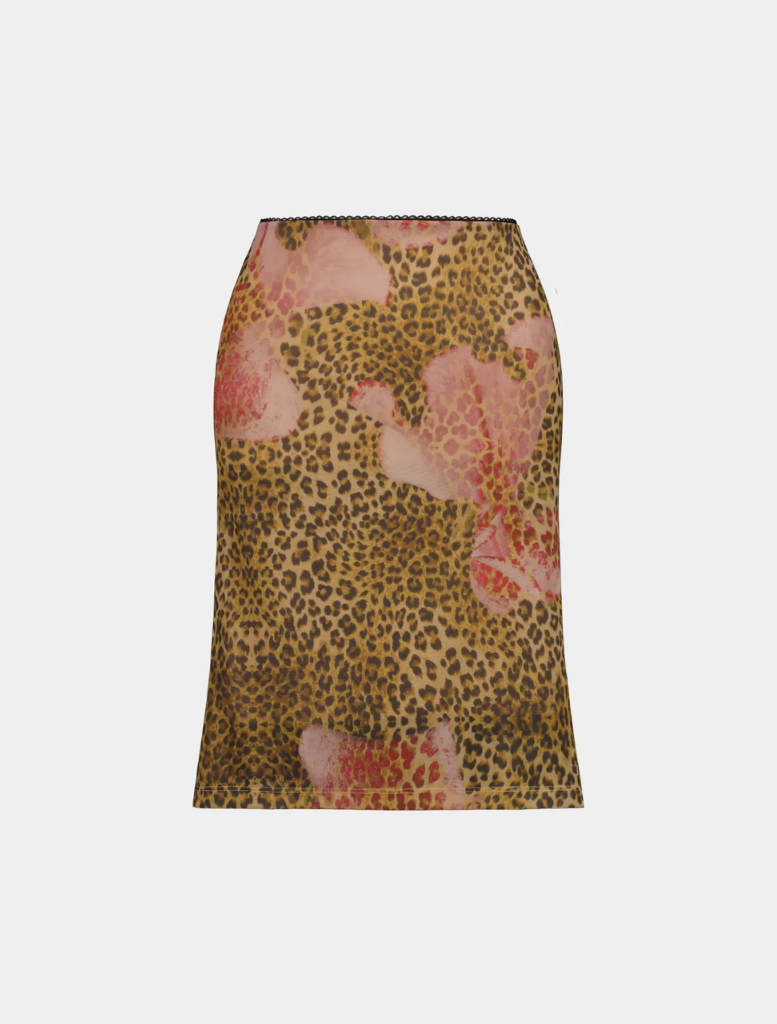 A stylish midi skirt featuring a leopard print design made of mesh fabric, elegantly draped on a hanger.