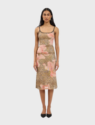 A stylish midi skirt featuring a mesh fabric with a leopard print pattern, ideal for trendy outfits.