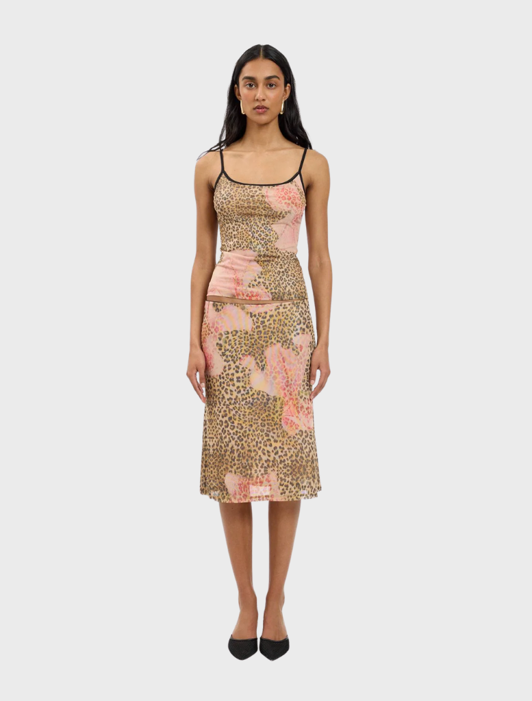 A stylish midi skirt featuring a mesh fabric with a leopard print pattern, ideal for trendy outfits.