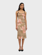 A stylish midi skirt featuring a mesh design with a leopard print pattern, perfect for a trendy outfit.