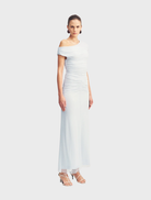 Sky blue maxi dress with off-shoulder design, showcasing a graceful silhouette suitable for outdoor gatherings.