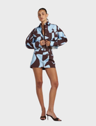 Contemporary Cropped Shacket with abstract Mirage design in brown and blue, perfect for effortless layering and travel.