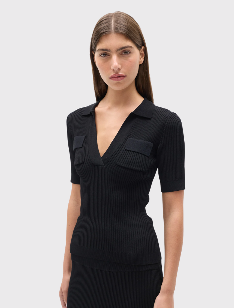 Ribbed black knit polo with a fitted design, V neckline, short sleeves, and flap-detail chest pockets.
