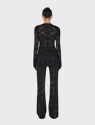 Misha's black long sleeve top, designed for comfort and versatility in any wardrobe.