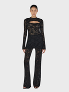 Misha Long Sleeve Top in black, featuring a sleek design suitable for casual or formal occasions.