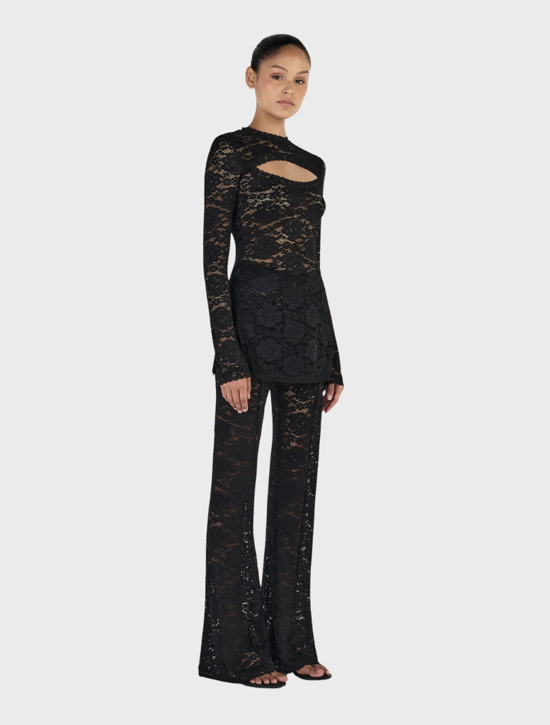 Classic black long sleeve top by Misha, ideal for both casual and formal settings.