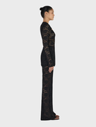 Misha Long Sleeve Top in black, offering a stylish and timeless addition to your clothing collection.
