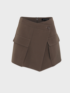Stylish mocha Vault Mini Skirt laid flat, highlighting its sleek design and soft fabric against a neutral backdrop.