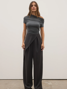 Casual dark heather grey Monica top hanging, highlighting its comfortable design and versatile color.