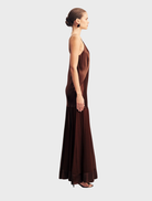 Coffee-colored Moraya Plunged Maxi Dress with a deep V-neck and a long, flowing skirt, ideal for formal events.