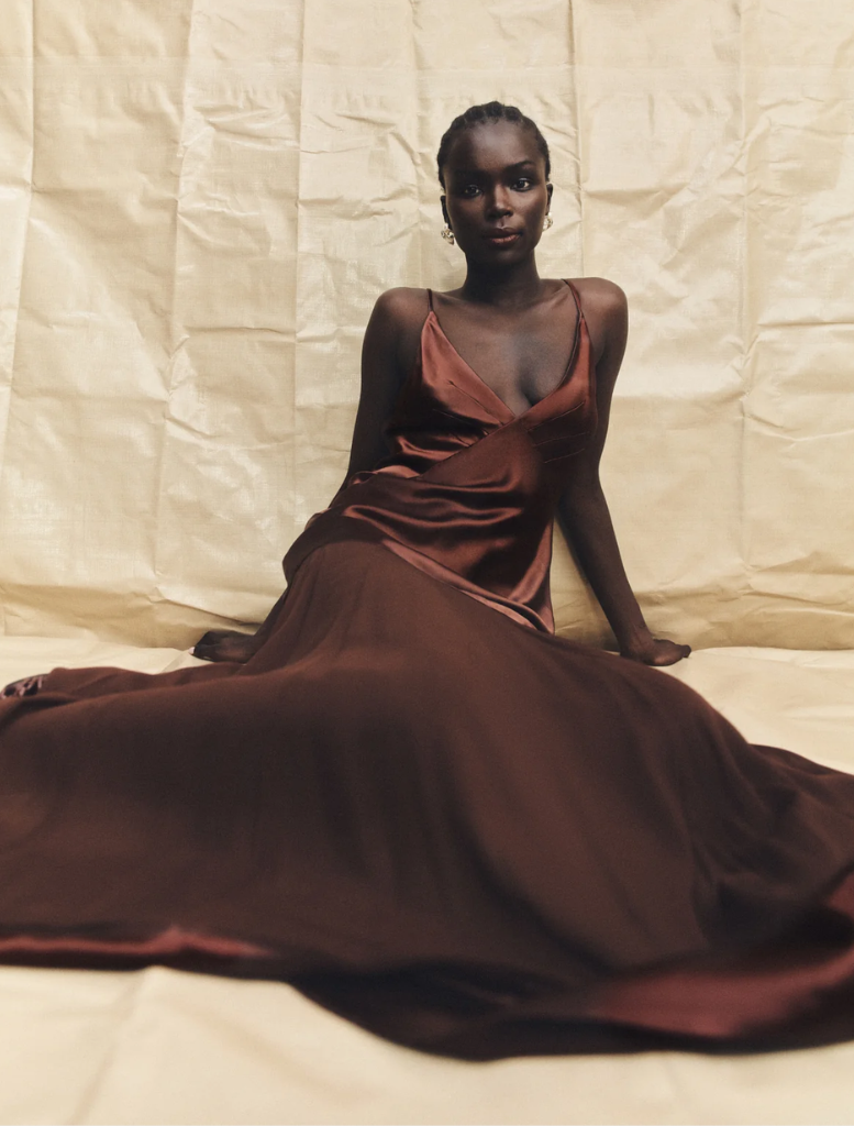 Elegant Moraya Plunged Maxi Dress in coffee, showcasing a deep V-neck and a long, flowing design for a chic appearance.