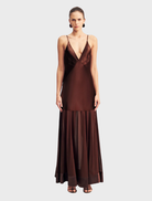 Moraya Plunged Maxi Dress in coffee color, featuring a deep neckline and flowing silhouette, perfect for elegant occasions.