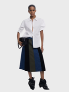 Colorful Evase skirt showcased on a hanger, featuring a flowing style and eye-catching patterns.