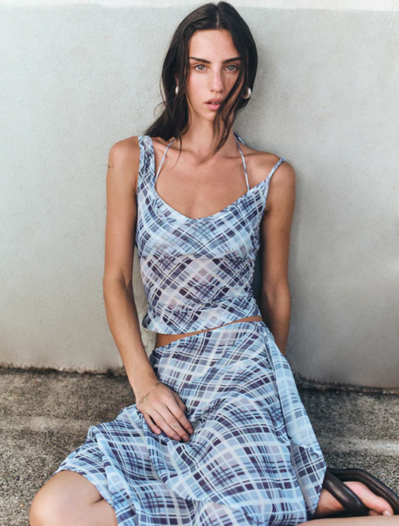 Sky plaid tank top by Natalia Layer, featuring a stylish design in soft blue and white tones.