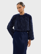 Navy Lola Crop Jacket with a modern cut, ideal for layering over outfits for a chic look.
