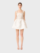 White and gold A-line mini dress featuring a fitted bodice and flared skirt, perfect for casual or semi-formal occasions.