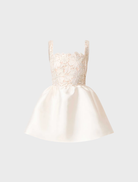 Nicoletta A-line mini dress in white and gold, showcasing a stylish design with a fitted top and flared bottom for elegance.