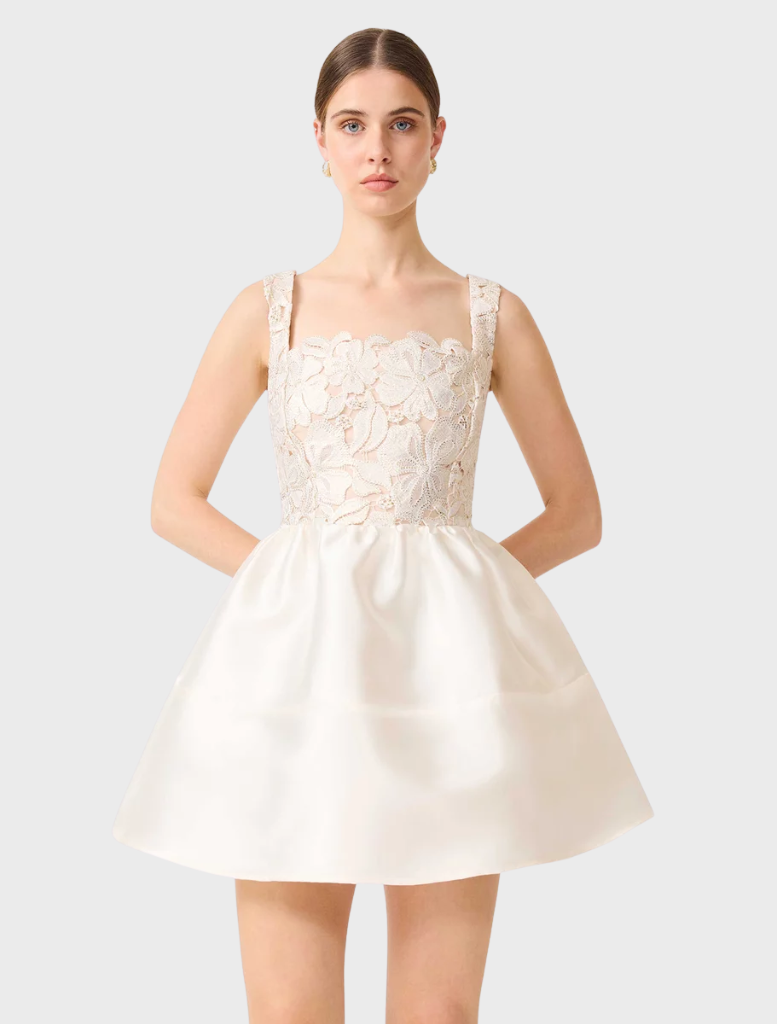 White and gold A-line mini dress with a fitted upper and flared lower, suitable for various occasions and stylish outings.