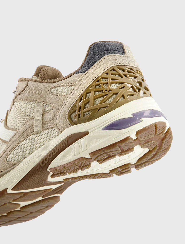 Retro running sneaker with a cushioned insole, breathable mesh, and suede panels for comfort and modern flair.