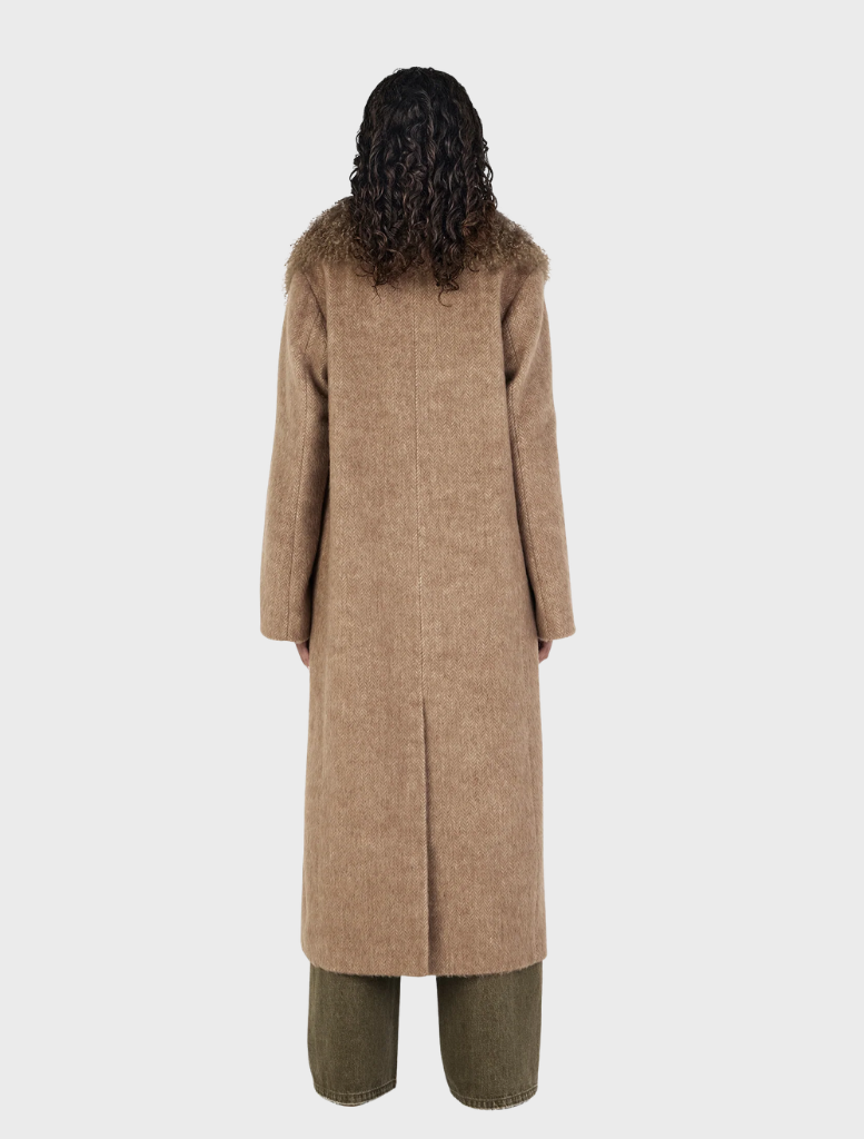 Oat-colored Valerie Coat, showcasing a modern silhouette perfect for layering in cooler weather.