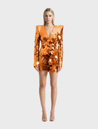 Orange mini dress with a prism shimmer effect, featuring a fitted silhouette and stylish design for a vibrant look.