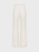 Ivory Otis Pant, illustrating its fit and overall aesthetic in a casual setting.