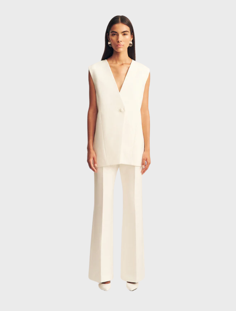 Ivory sleeveless blazer by Otis, featuring a tailored design suitable for formal or casual occasions.