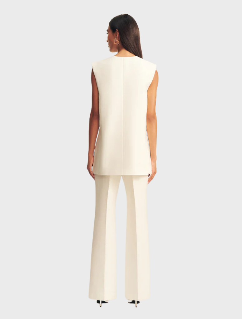 Stylish ivory sleeveless blazer by Otis, ideal for enhancing outfits with a contemporary and refined touch.