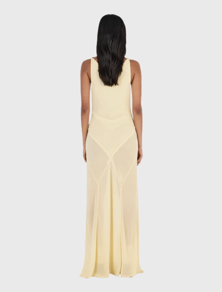 Elegant butter yellow gown with a scoop cowl neck, twist strap design, and a flowing panelled bias-cut maxi skirt.