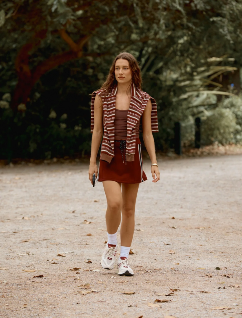 Palmer mini skirt in burgundy, highlighting its chic style and fabric, set on a plain white background.