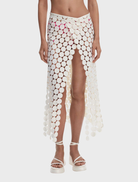 White pareo featuring a circular pattern, ideal for beachwear or casual summer outfits.