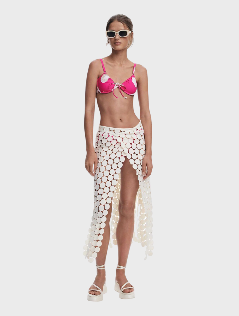 Chic white pareo showcasing a unique circular motif, great for warm weather and beach outings.