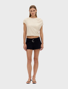 Elegant black mini shorts by Passage, designed for a tailored fit, perfect for summer fashion.