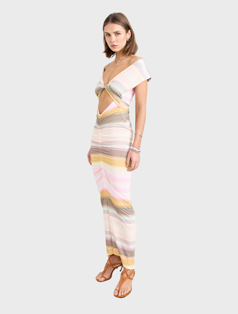 Elegant Elara Dress in peach, designed with a flattering silhouette for versatile wear.