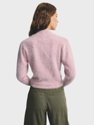 Petal Cloud Bella Cashmere Cardigan, a lightweight and elegant piece in a delicate pink shade for versatile wear.