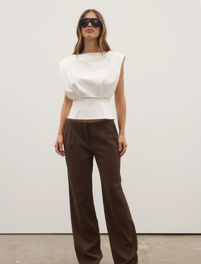 Chocolate-colored Pietra Pant displayed on a neutral background, showcasing its sleek design and tailored fit.