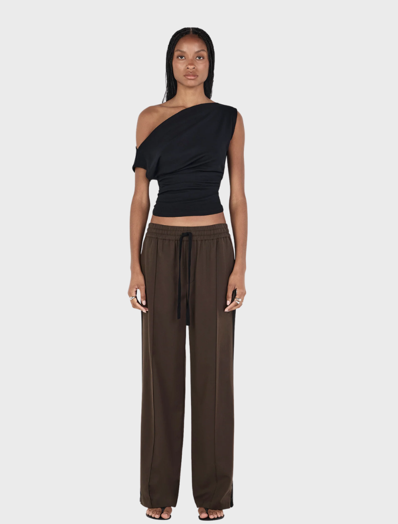 Close-up of a black Pip wool top, highlighting its smooth fabric and elegant silhouette.