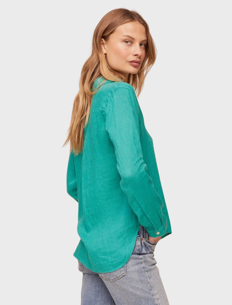 Aqua green button-down shirt with a chest pocket, neatly arranged to emphasize its casual design and color.