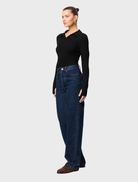 Sleek black polo top from Florence, combining comfort and style for a refined casual appearance.
