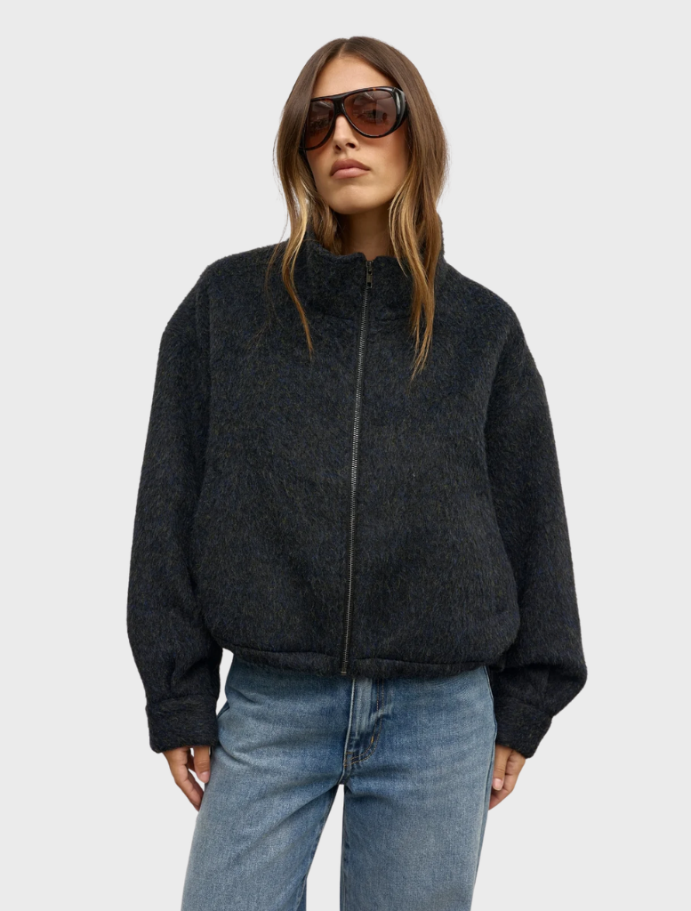The Preslie Bomber in deep ocean blue, featuring a sleek design, displayed against a neutral background.