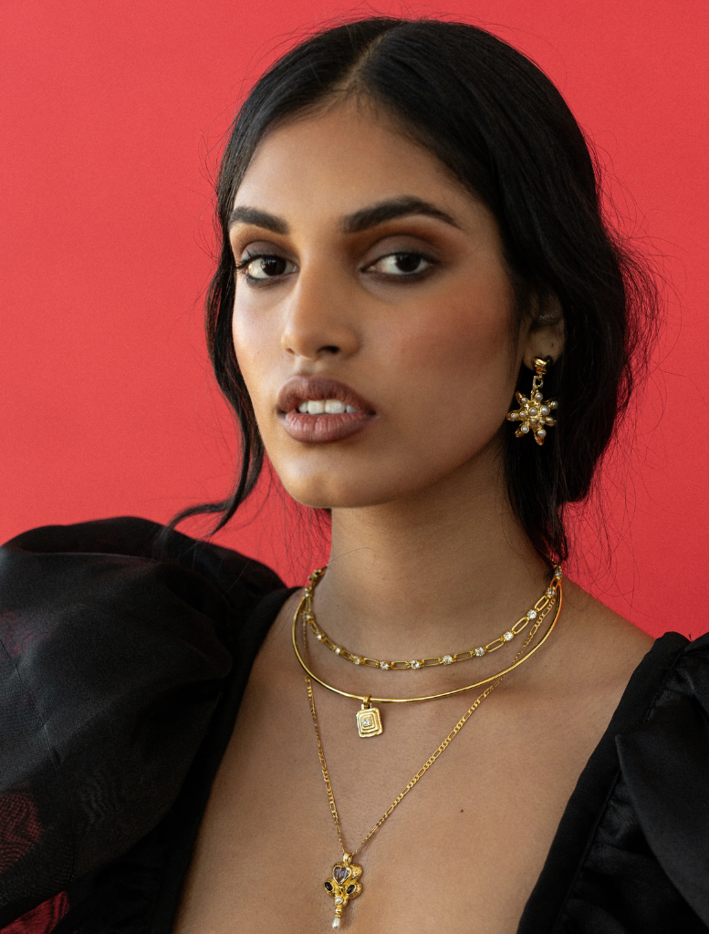 Elegant gold Priya necklace with detailed craftsmanship, ideal for enhancing any outfit.