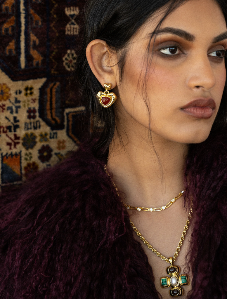 Gold Priya necklace featuring intricate design and elegant finish, suitable for formal or casual occasions.

