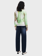 Thin gauge pullover adorned with an abstract art print, offering a stylish and modern look.