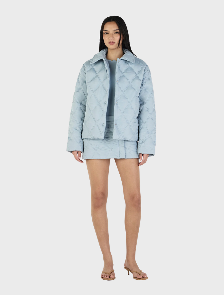 Ice blue quilted jacket by Quinton, combining comfort and fashion for a versatile winter wardrobe essential.